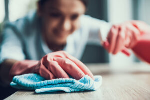 Woman in Gloves Cleaning House
