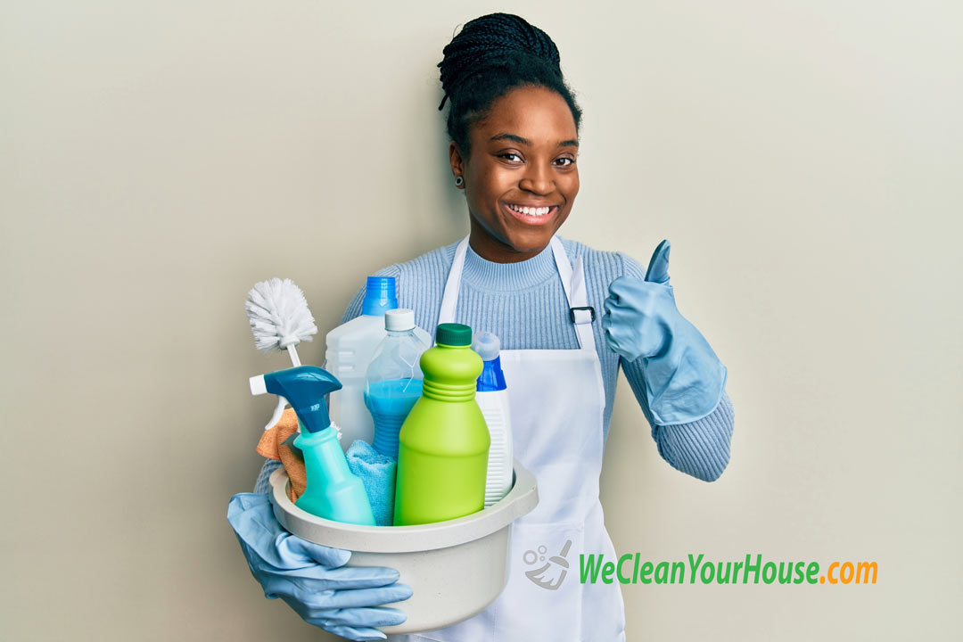 Professional House Cleaner holding Eco-Friendly-products
